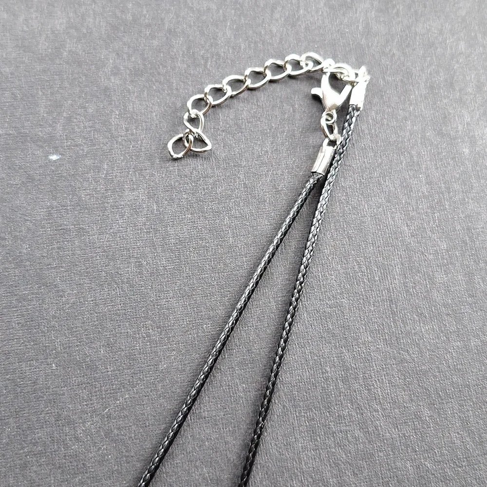 White crystal point pendant necklace on 16-inch faux leather chain